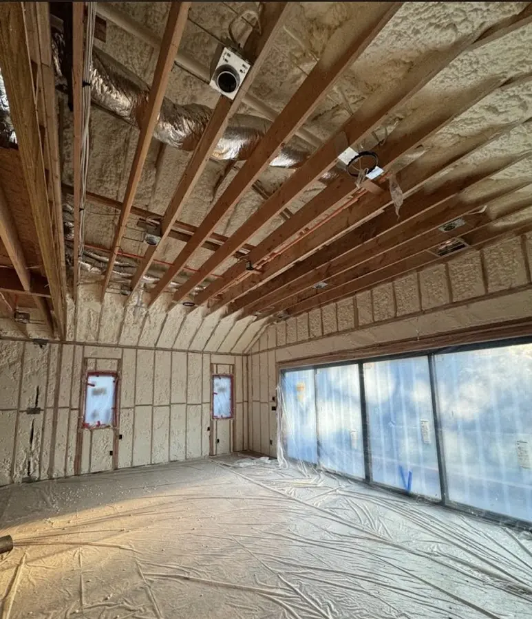 Interior walls and ceiling insulated with spray foam during new construction in Moundsville